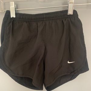 Children’s black Nike shorts.